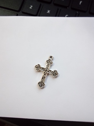 Silver cross over stainless steel 