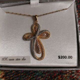 Gold sterling silver cross necklace retails $200