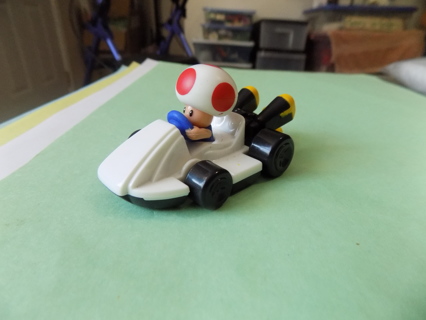 Toad Nintendo toy Mario Kart Racer in white race car green pipes out the back