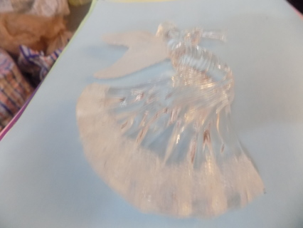 Clear acrylic angel 7 inch tall with frosted wings blowing a trumpet, textured hem on gown