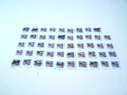 United States Flag Postage Stamps used set of 49 still on paper.